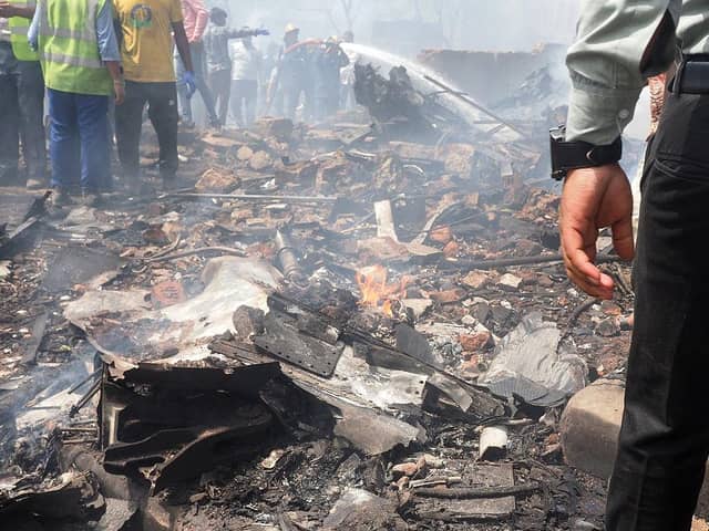 Debris is seen at the site where Air India flight 171 crashed in a residential area near the airport in Ahmedabad on June 12, 2025. The London-bound passenger plane crashed on June 12 in India's western city of Ahmedabad with 242 on board, aviation officials said in what the airline called a "tragic accident". (Photo by Sam PANTHAKY / AFP) (Photo by SAM PANTHAKY/AFP via Getty Images)