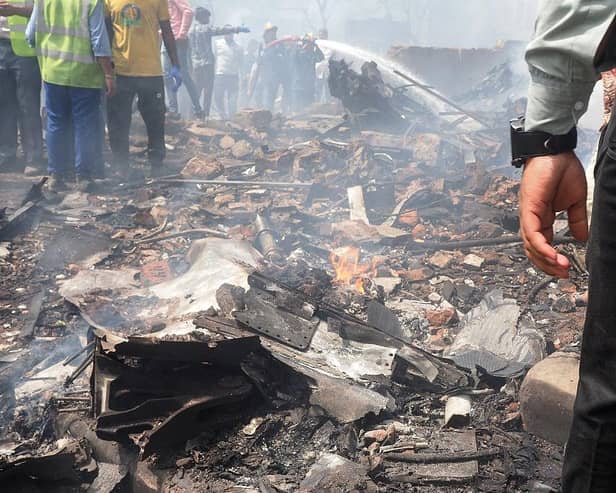 Debris is seen at the site where Air India flight 171 crashed in a residential area near the airport in Ahmedabad on June 12, 2025. The London-bound passenger plane crashed on June 12 in India's western city of Ahmedabad with 242 on board, aviation officials said in what the airline called a "tragic accident". (Photo by Sam PANTHAKY / AFP) (Photo by SAM PANTHAKY/AFP via Getty Images)
