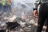 Debris is seen at the site where Air India flight 171 crashed in a residential area near the airport in Ahmedabad on June 12, 2025. The London-bound passenger plane crashed on June 12 in India's western city of Ahmedabad with 242 on board, aviation officials said in what the airline called a "tragic accident". (Photo by Sam PANTHAKY / AFP) (Photo by SAM PANTHAKY/AFP via Getty Images)