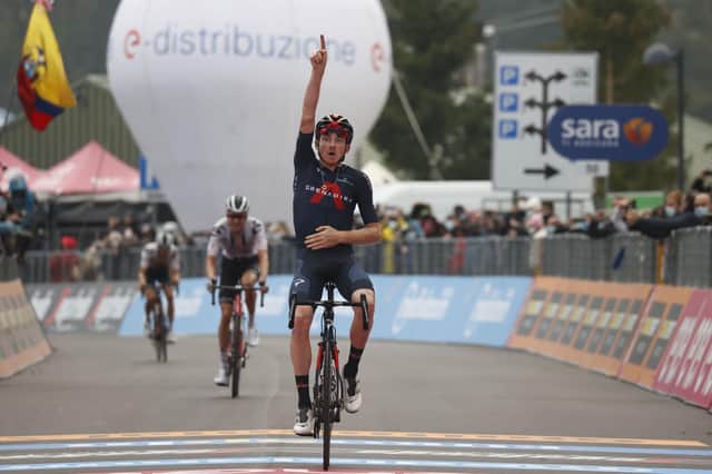 Team Ineos rider Tao Geoghegan Hart celebrates as he crosses the line to win the 15th stage of the Giro d'Italia, a 185-kilometre route between Base Aerea Rivolto and Piancavallo.