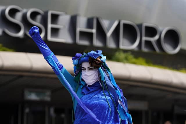 Extinction Rebellion Scotland's Blue Rebels perform outside the SEC Armadillo in Glasgow, where the global climate change conference Cop26 will take place in November. Picture: PA