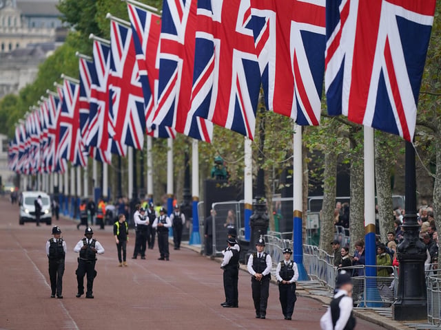 Police on The Mall ahead of the ceremonial procession of the coffin of Queen Elizabeth II, from Buckingham Palace to Westminster Hall, London, where it will lie in state ahead of her funeral on Monday. Picture date: Wednesday September 14, 2022.