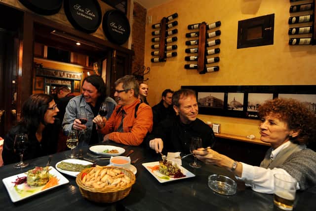 Food flows along with the wine at tapas bars like this one in Madrid (Picture: Jasper Juinen/Getty Images)