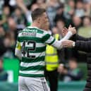 Celtic manager Ange Postecoglou shakes hands with captain Callum McGregor.  (Photo by Craig Williamson / SNS Group)