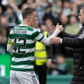 Celtic manager Ange Postecoglou shakes hands with captain Callum McGregor.  (Photo by Craig Williamson / SNS Group)