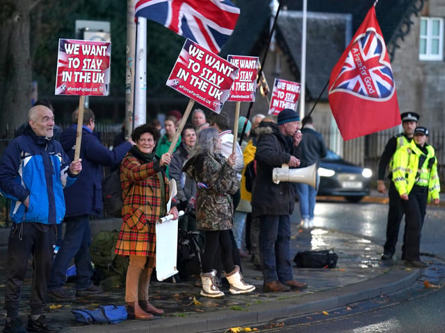 "We want to stay in the UK" reads signs at a pro Union rally