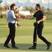 Scott Jamieson, left, congratulates Thomas Pieters on his win in the Abu Dhabi HSBC Championship at Yas Links. Picture: Warren Little/Getty Images.