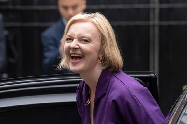 Labour Chancellor Rachel Reeves is taking a very different approach to Liz Truss, pictured on her first day as Conservative leader, (Picture: Carl Court/Getty Images)