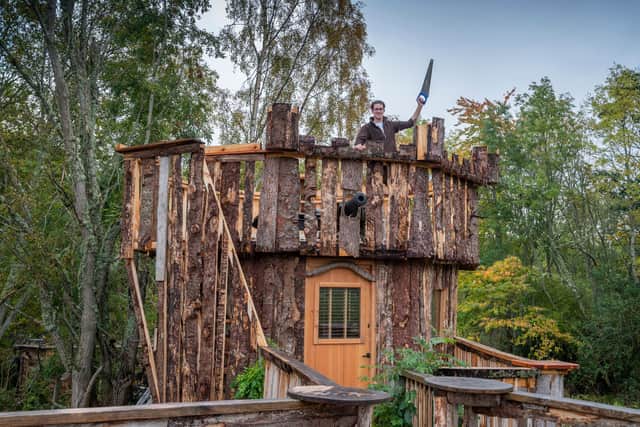 Fergus Hart , 22, from near Inverness, who has been keeping busy during the coronavirus Covid 19 lockdown building a castle tree house from timber, reaching unto around 30ft at its top picture: Phil Wilkinson