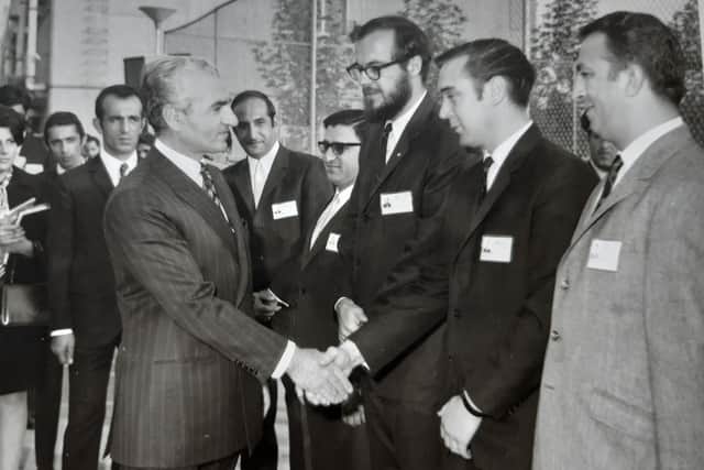 George Lindsay shakes hands with the Shah at Aryamehr University of Technology in Tehran where he worked as an associate professor for a year in 1970. The Shah was the chancellor of the university. Picture: George Lindsay