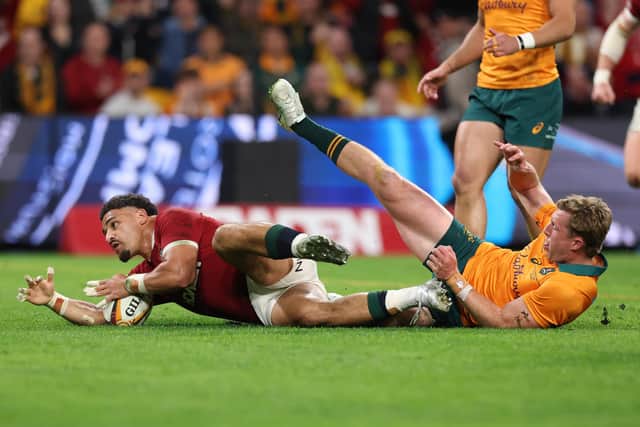 Sione Tuipulotu of British and Irish Lions goes over for the first try of the match despite the efforts of Harry Potter of Australia the Lions' win in the first Test at Suncorp Stadium in Brisbane. (Photo by David Rogers/Getty Images)