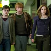 Daniel Radcliffe as Harry Potter, Rupert Grint as Ron Weasley and Emma Watson as Hermione Granger; the Golden Trio will return to discuss the original film series in a TV special. Photo: PA Photo/Warner Bros. Pictures.