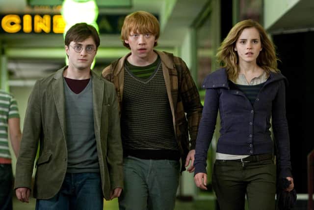 Daniel Radcliffe as Harry Potter, Rupert Grint as Ron Weasley and Emma Watson as Hermione Granger; the Golden Trio will return to discuss the original film series in a TV special. Photo: PA Photo/Warner Bros. Pictures.