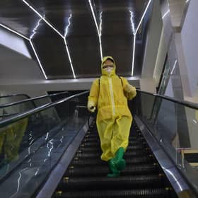 An employee sprays disinfectant as part of preventative measures against the Covid-19 coronavirus at the Pyongyang Children's Department Store in Pyongyang last month.
