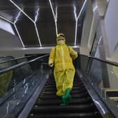 An employee sprays disinfectant as part of preventative measures against the Covid-19 coronavirus at the Pyongyang Children's Department Store in Pyongyang last month.