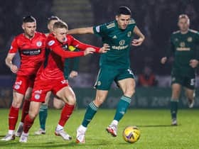 PAISLEY, SCOTLAND - DECEMBER 22: Dylan Reid and Tom Rogic in action during a Cinch Premiership match between St. Mirren and Celtic at SMiSA Stadium, on December 22, 2021, in Paisley, Scotland.  (Photo by Craig Williamson / SNS Group)