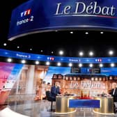 French President and La Republique en Marche (LREM) party candidate for re-election Emmanuel Macron (L) and   French far-right party Rassemblement National (RN) presidential candidate Marine Le Pen (R) Photo by Ludovic Marin AFP via Getty Images