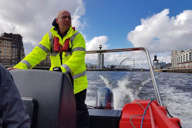 Gordon Goldie at the helm of the Glasgow Humane Society's new boat. (Picture: GHS)