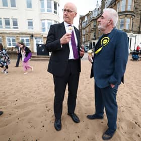 SNP leader and First Minister John Swinney while campaigning with Tommy Sheppard, who is among a long list of party MPs who have lost their seats. Picture: Getty Images