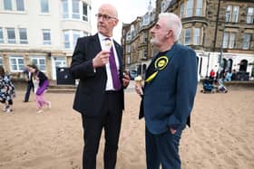 SNP leader and First Minister John Swinney while campaigning with Tommy Sheppard, who is among a long list of party MPs who have lost their seats. Picture: Getty Images