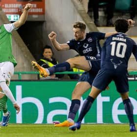 Ross County's Jordan White (C) scores to make it 2-2 against Hibs.