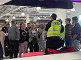 Police were seen at Edinburgh Airport's baggage reclaim area trying to manage the situation.
