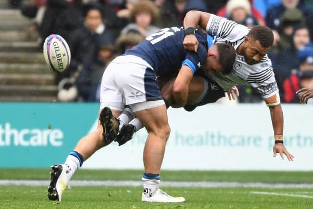 Scotland's Ben White tackles Fiji's Viliame Mata during the 28-12 win at Murrayfield.   (Photo by Ross MacDonald / SNS Group)