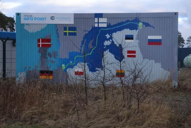 A map shows the course of the Nord Stream 2 gas pipeline from Russia to Germany on the exterior of an informational booth close to the receiving station for Nord Stream 2 near Lubmin, Germany.