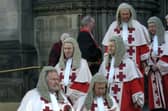 Judges in their red robes leave St Giles' Cathedral in Edinburgh after a Kirking of the Court ceremony