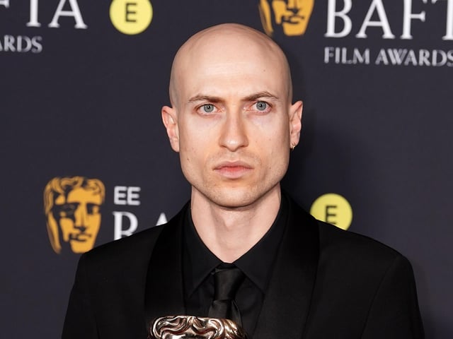 Daniel Blumberg in the press room after winning the Best Original Score award for The Brutalist during the 78th British Academy Film Awards