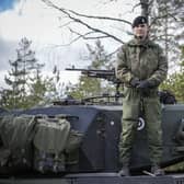 A Finnish soldier stands on top of his tank during the Arrow 22 military exercise with UK, Latvian, Estonian and US forces in Finland this month (Picture: Alessandro Rampazzo/AFP via Getty Images)