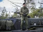 A Finnish soldier stands on top of his tank during the Arrow 22 military exercise with UK, Latvian, Estonian and US forces in Finland this month (Picture: Alessandro Rampazzo/AFP via Getty Images)