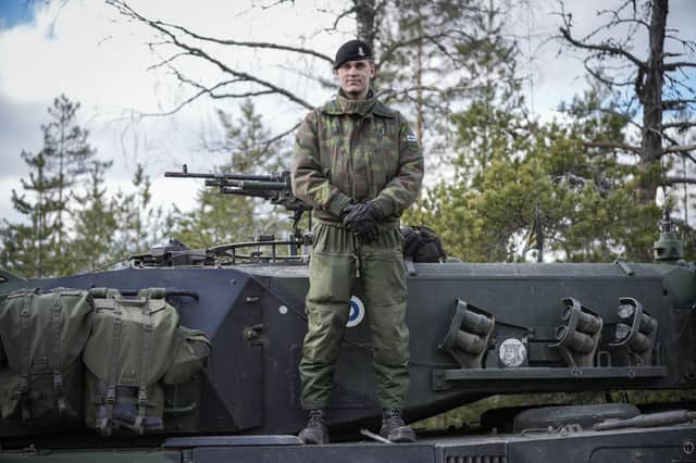 A Finnish soldier stands on top of his tank during the Arrow 22 military exercise with UK, Latvian, Estonian and US forces in Finland this month (Picture: Alessandro Rampazzo/AFP via Getty Images)