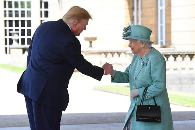 Donald Trump is greeted by Queen Elizabeth II at Buckingham Palace during his previous state visit in June 2019 (Picture: Victoria Jones/WPA Pool/Getty Images)