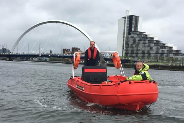 The new boat on the Clyde in front of the "Squinty Bridge" or Clyde Arc. Picture: Glasgow Humane Society