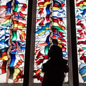A stained glass memorial window in Lockerbie Town Hall depicting flags from all the nations that lost citizens in the bombing