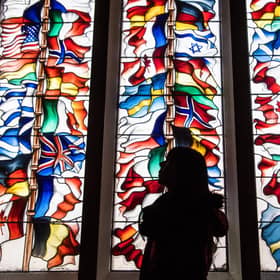 A stained glass memorial window in Lockerbie Town Hall depicting flags from all the nations that lost citizens in the bombing