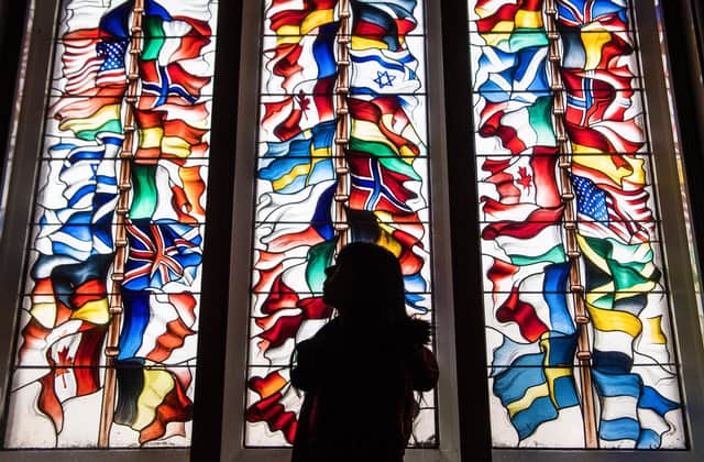 A stained glass memorial window in Lockerbie Town Hall depicting flags from all the nations that lost citizens in the bombing