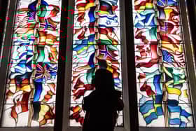 A stained glass memorial window in Lockerbie Town Hall depicting flags from all the nations that lost citizens in the bombing