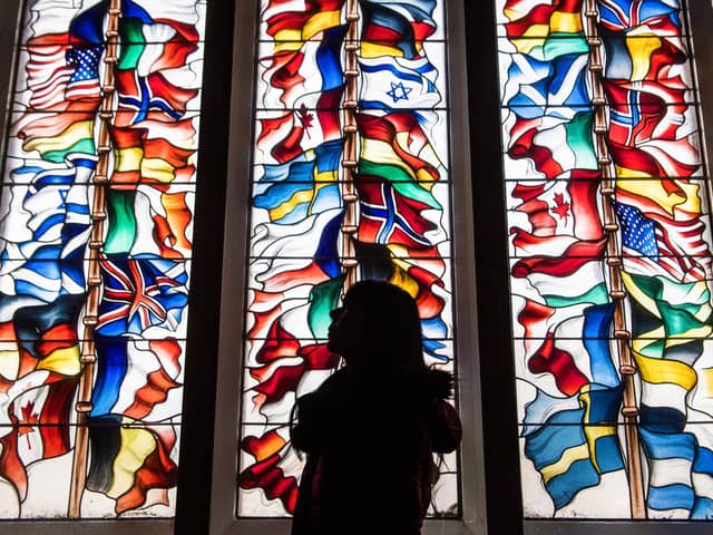 A stained glass memorial window in Lockerbie Town Hall depicting flags from all the nations that lost citizens in the bombing