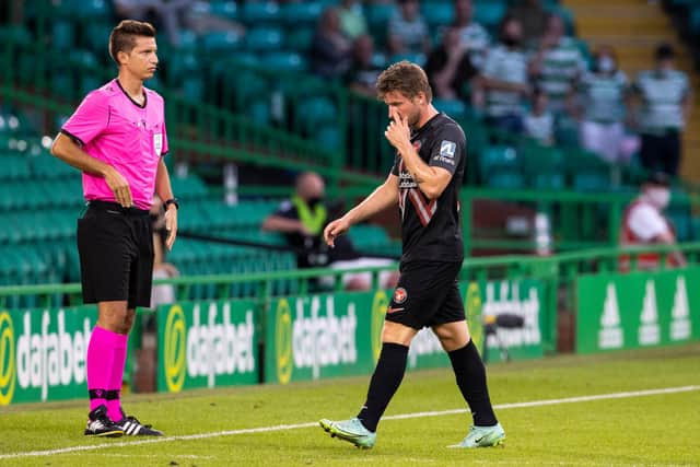 Anders Dreyer trudges off after his red card.