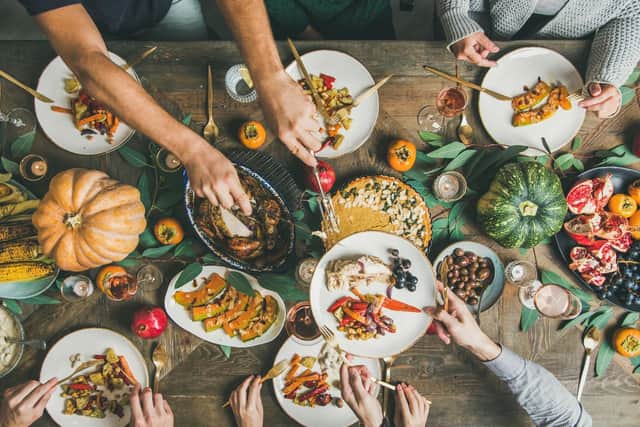 Traditionally, turkey and other autumnal foods are shared over a meal with family and friends. Photo: Foxys_forest_manufacture / Getty Images / Canva Pro.