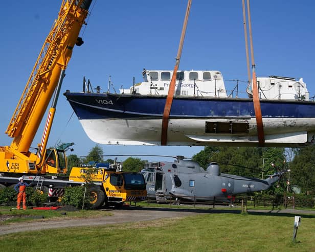 A former RNLI lifeboat is lowered into Martyn Steedman's camping site at Mains Farm in Thornhill, Stirlingshire (Picture: Andrew Milligan/PA Wire)
