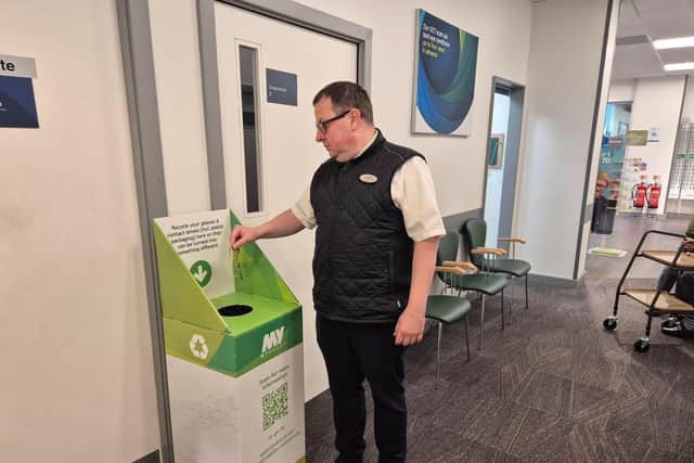 Specsavers Blackhall Sainsbury's team member Tomasz Mozga with the in-store recycling point