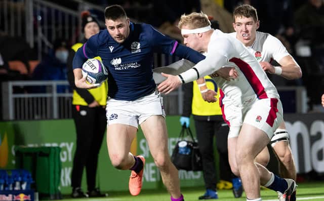 Scotland's Ross McKnight is tackled by England's Will Hobson during a Six Nations Under-20 match at the DAM Health Stadium on February 4, 2022. (Photo by Ross Parker / SNS Group)