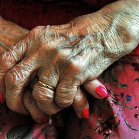 The hands of a resident at a nursing home. Picture: John Stillwell/PA Wire