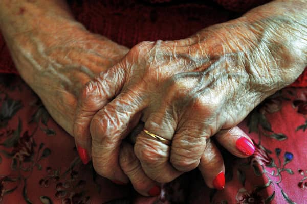 The hands of a resident at a nursing home. Picture: John Stillwell/PA Wire