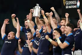 Jamie Ritchie of Scotland lifts the Calcutta Cup last year.