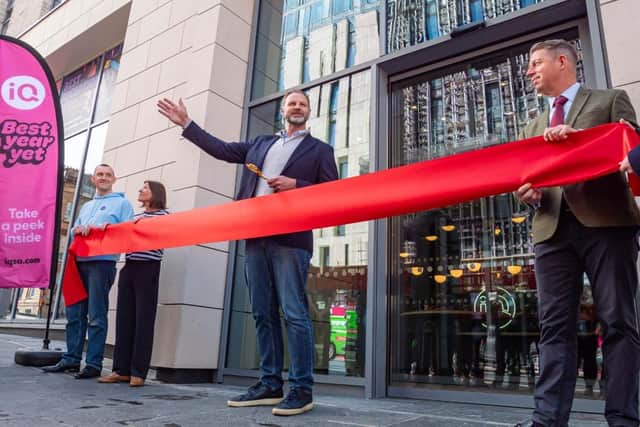 iQ CEO Matt Merrick preparing to cut the ribbon at the new Glasgow site. Picture: Alistair Leith