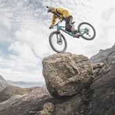 Danny MacAskill cycles down a moderate rock climb known as The Slabs on Skye